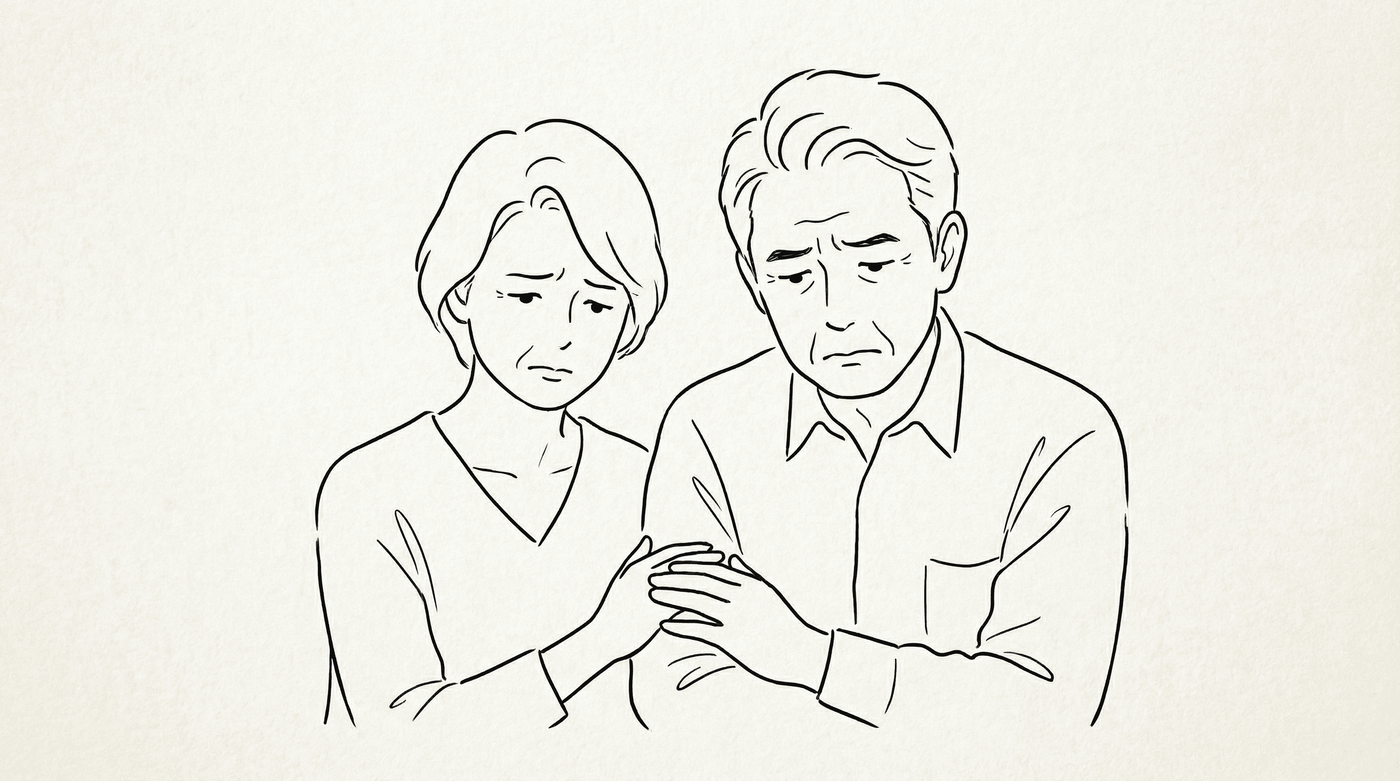 困った表情の中高年夫婦